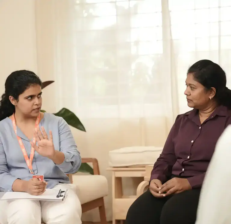 Two Women Having A Counselling Session Indoors